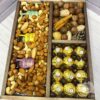 Орехи, конфеты и мед в ящике